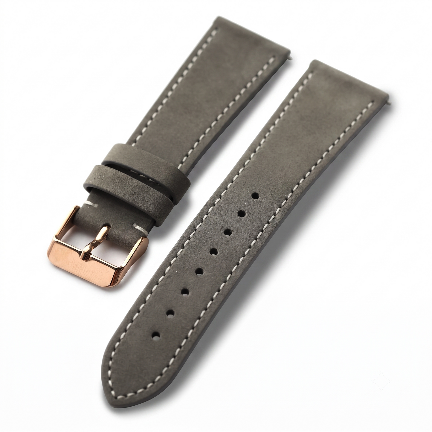 A gray suede watch strap with white contrast stitching and a rose gold buckle, displayed on a clean white background.