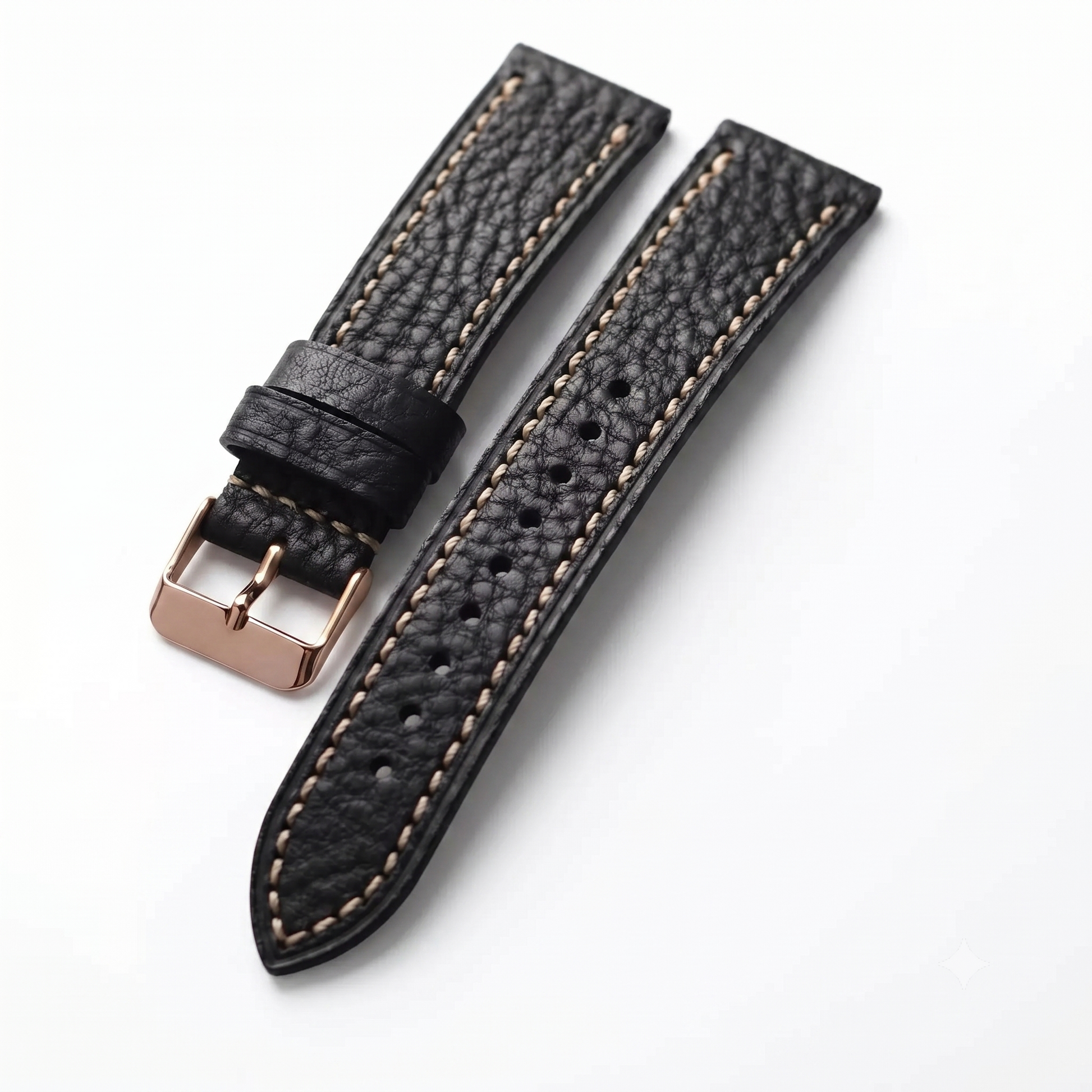 Black leather watch strap with rose gold buckle on a white background