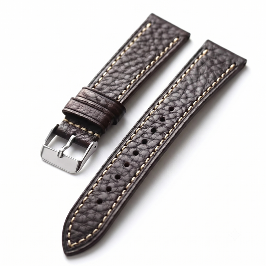 Brown leather watch strap with stitching detail on a white background