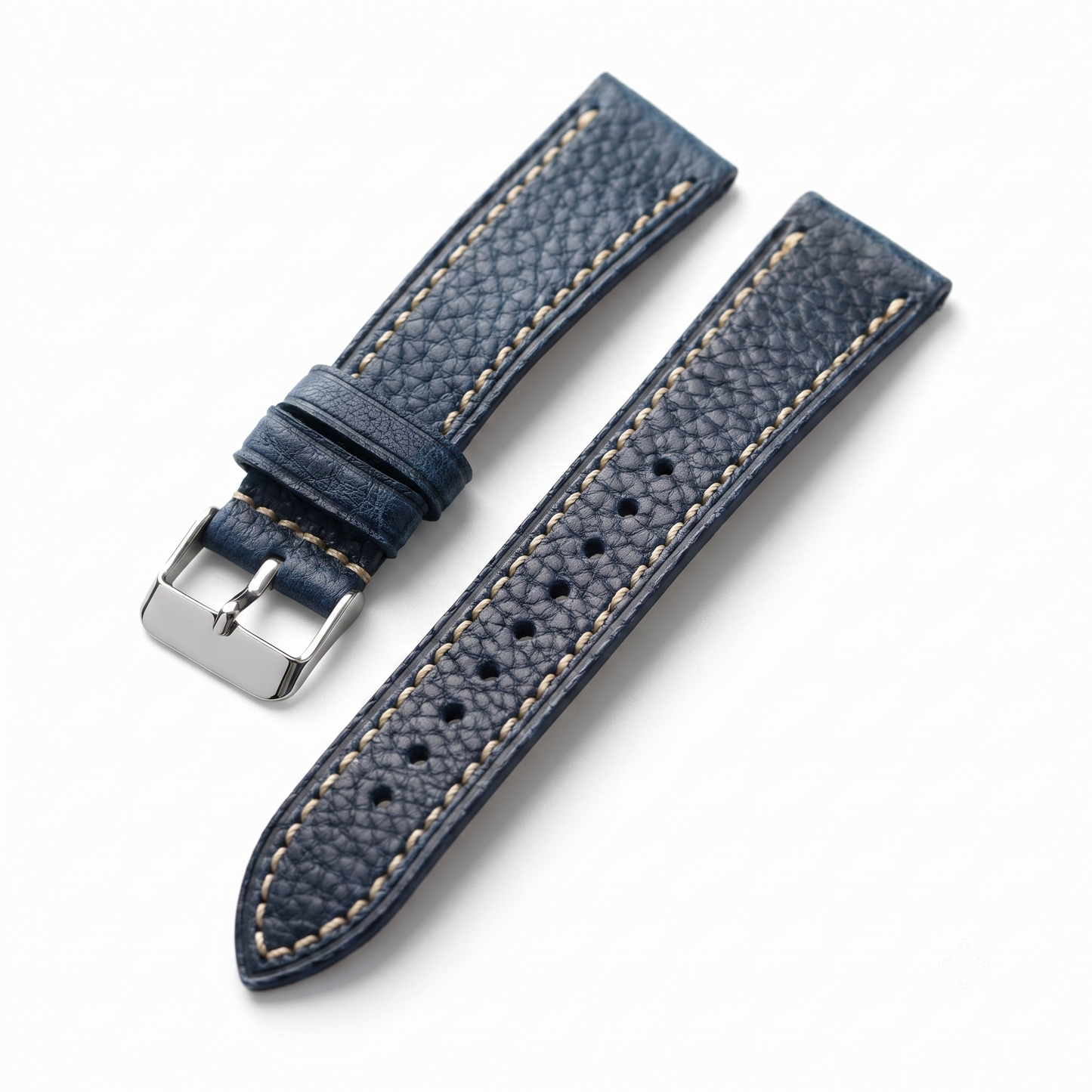 Blue leather watch strap with silver buckle on a white background