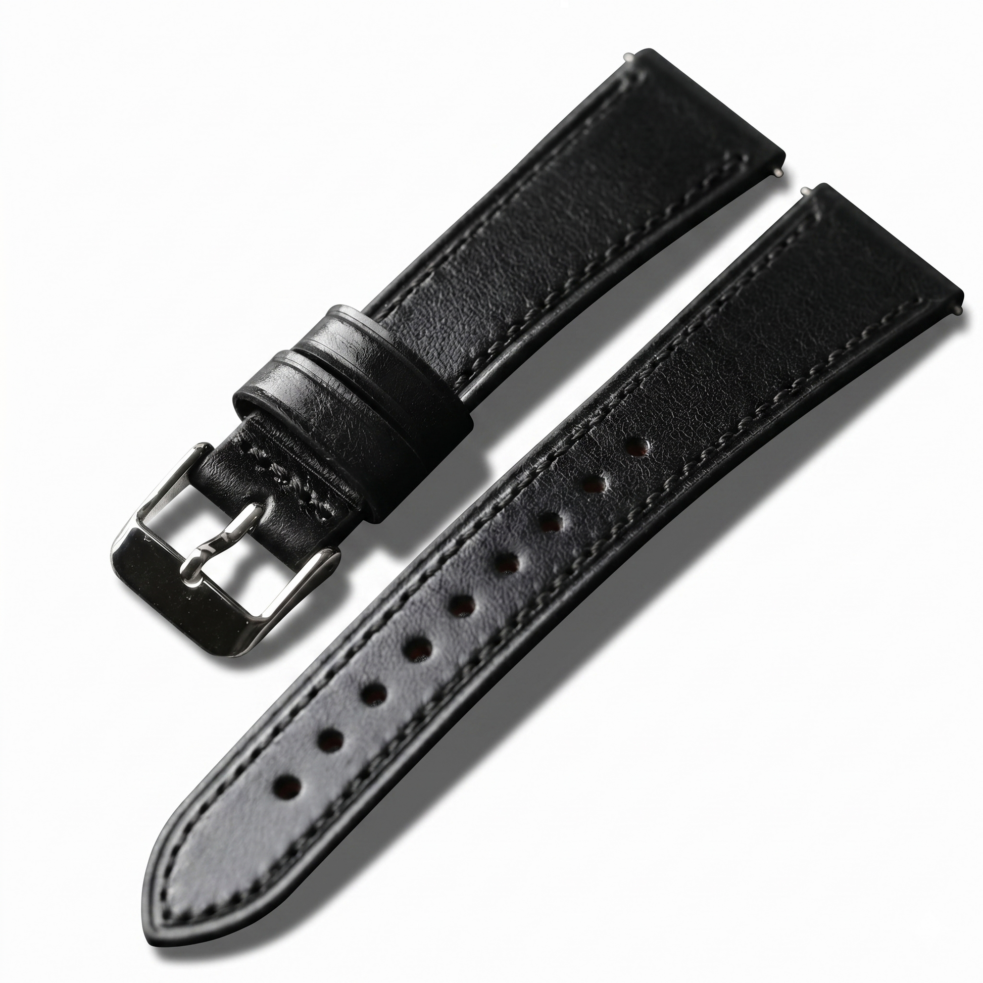 Black leather watch strap with silver buckle on a white background