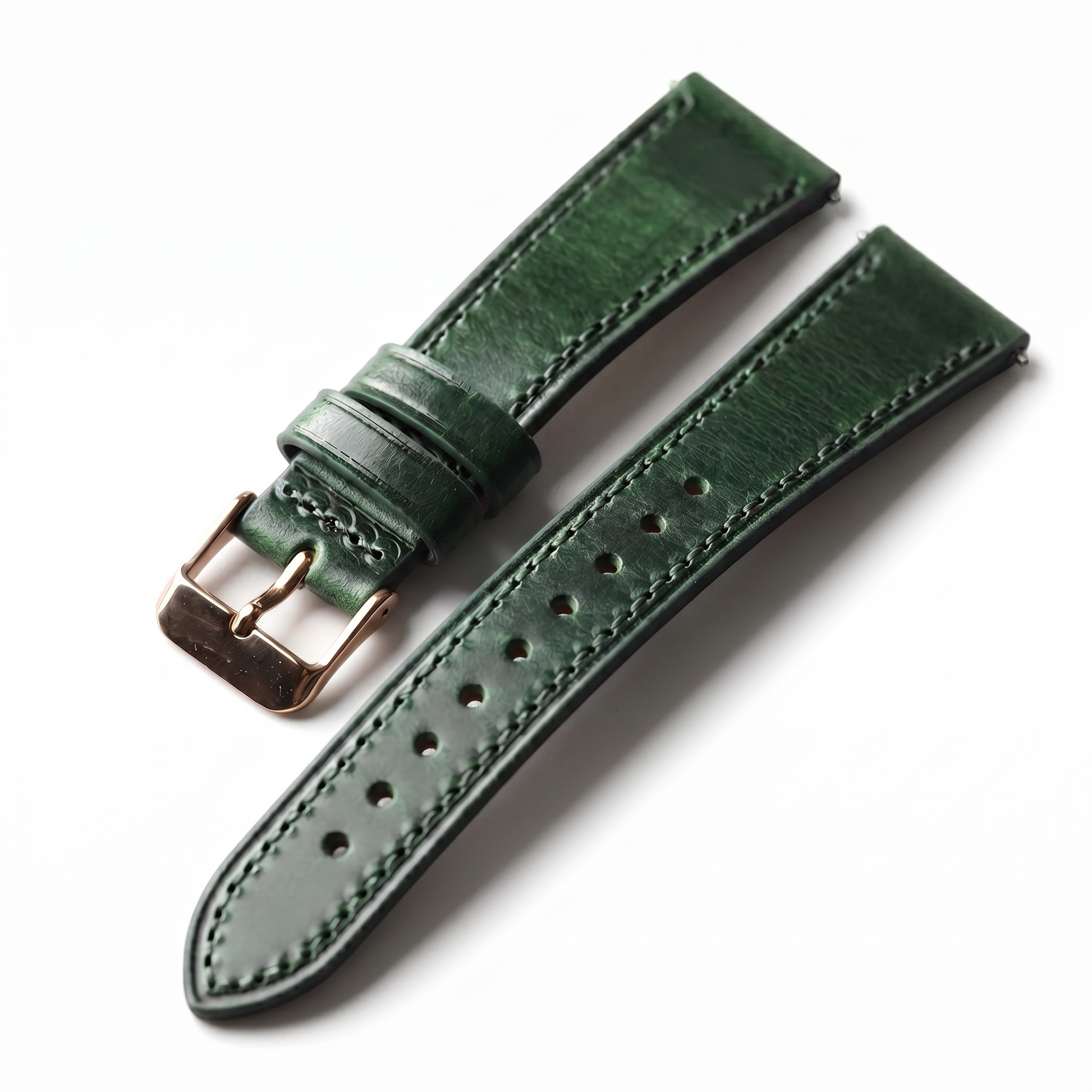 Green leather watch strap with rose gold buckle on a white background