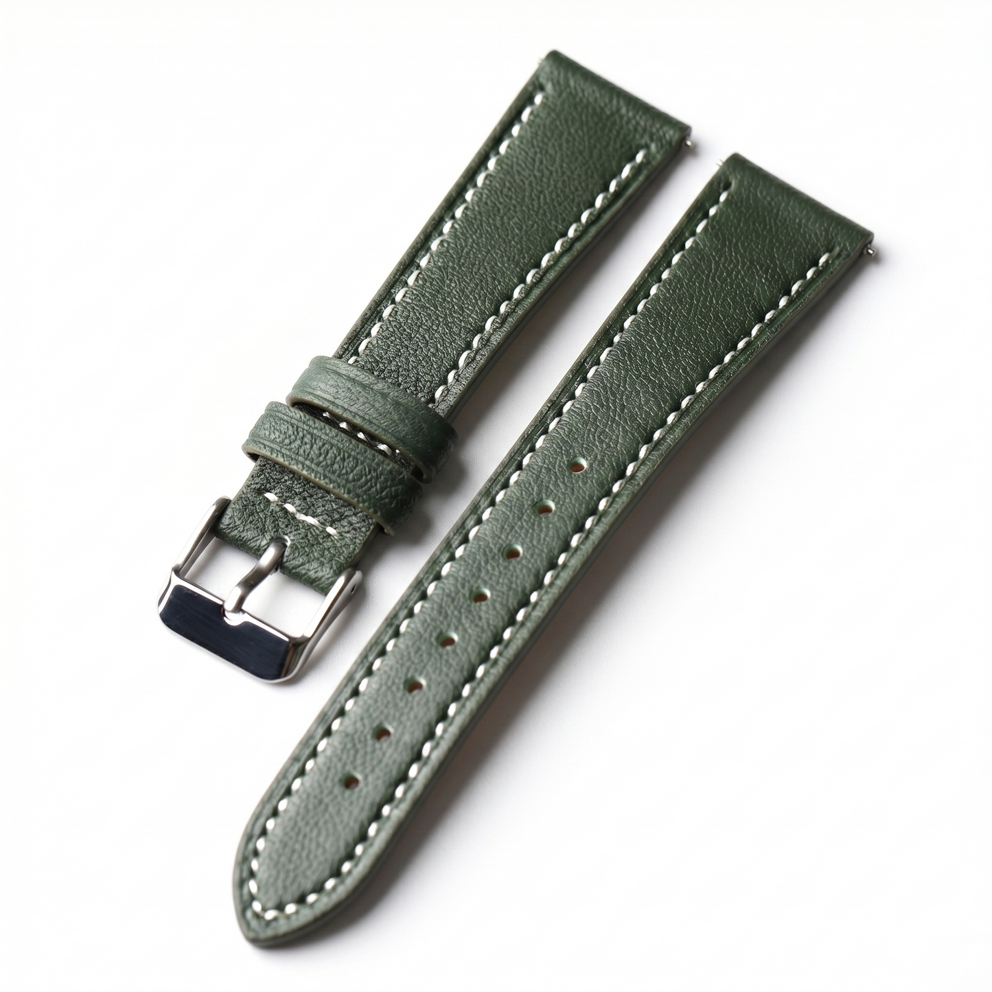 Green leather watch strap with silver buckle on a white background