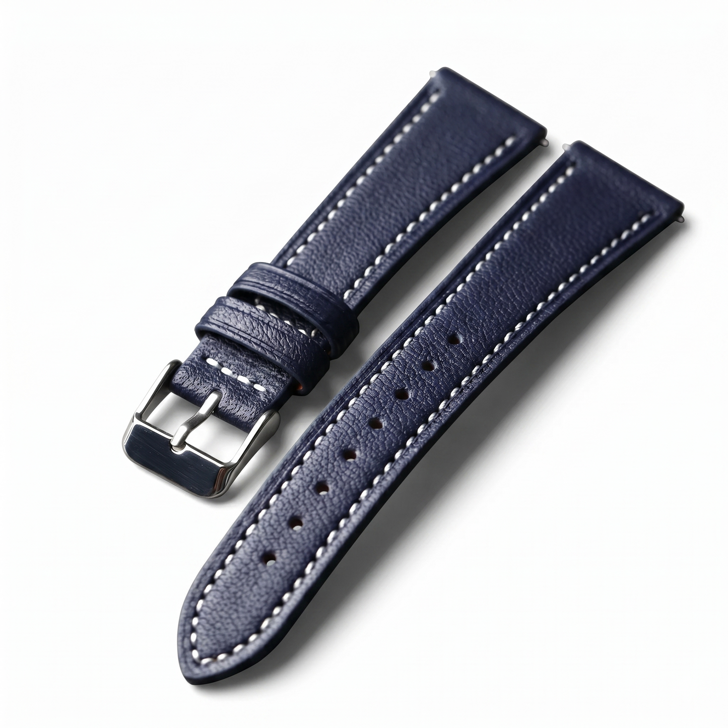 Navy blue leather watch strap with silver buckle on a white background