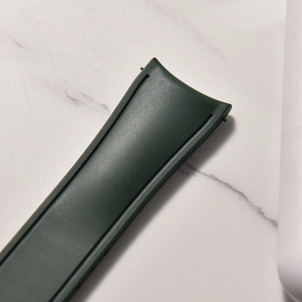 Green rectangular object on a marble surface