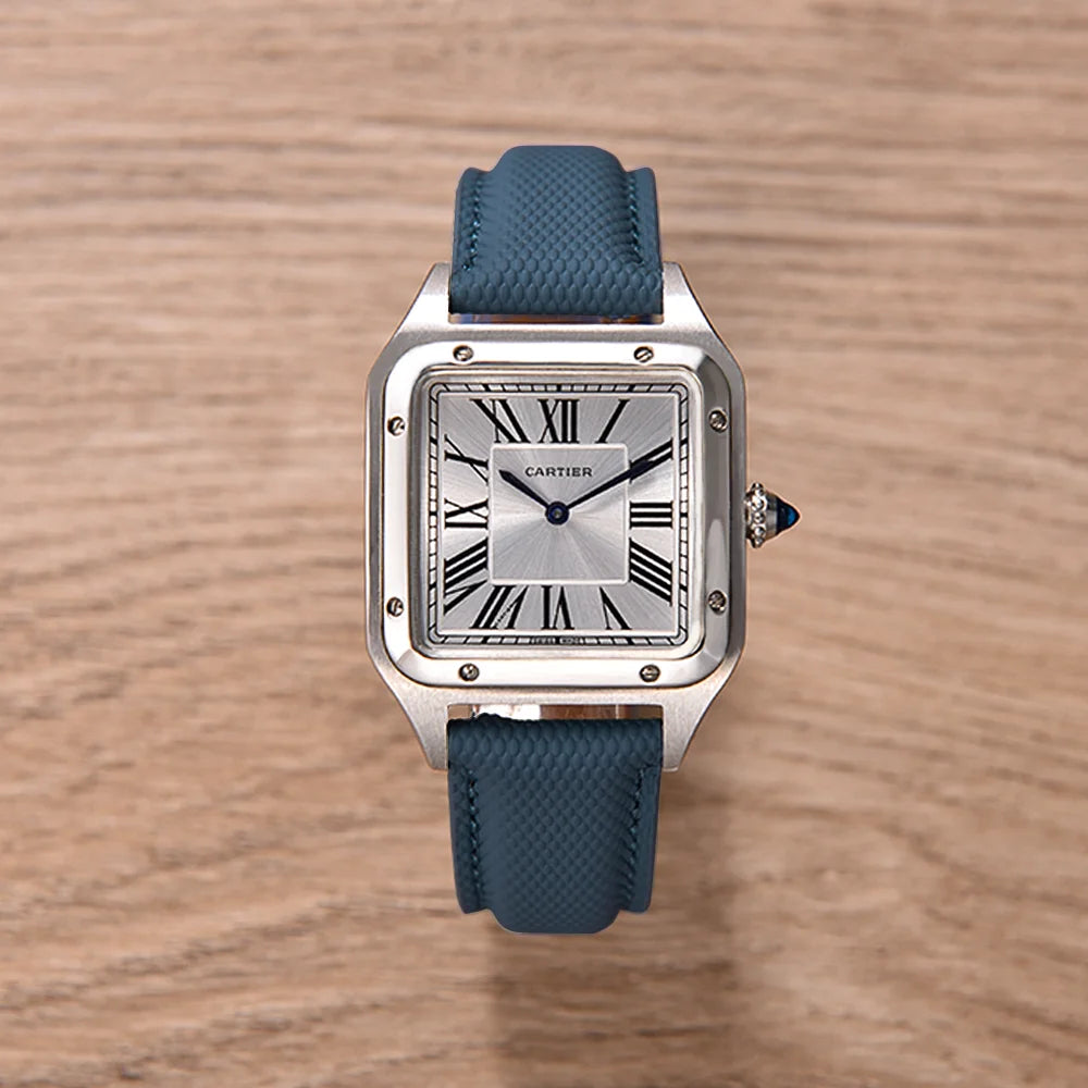 Cartier watch with blue strap on a wooden surface