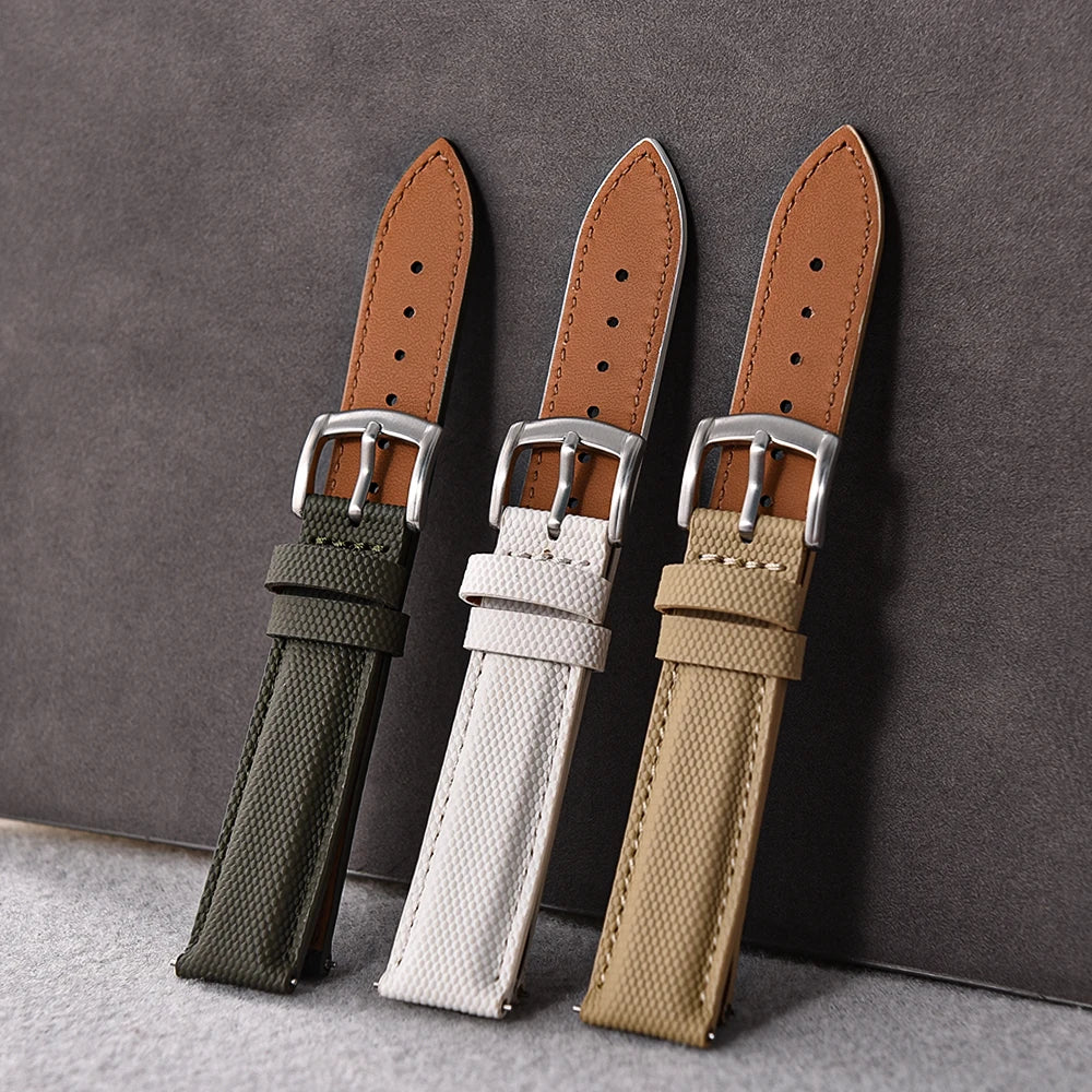 Three watch straps in green, white, and beige with silver buckles on a gray background