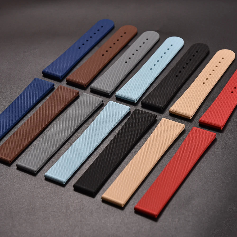 Set of colorful watch straps arranged on a dark surface