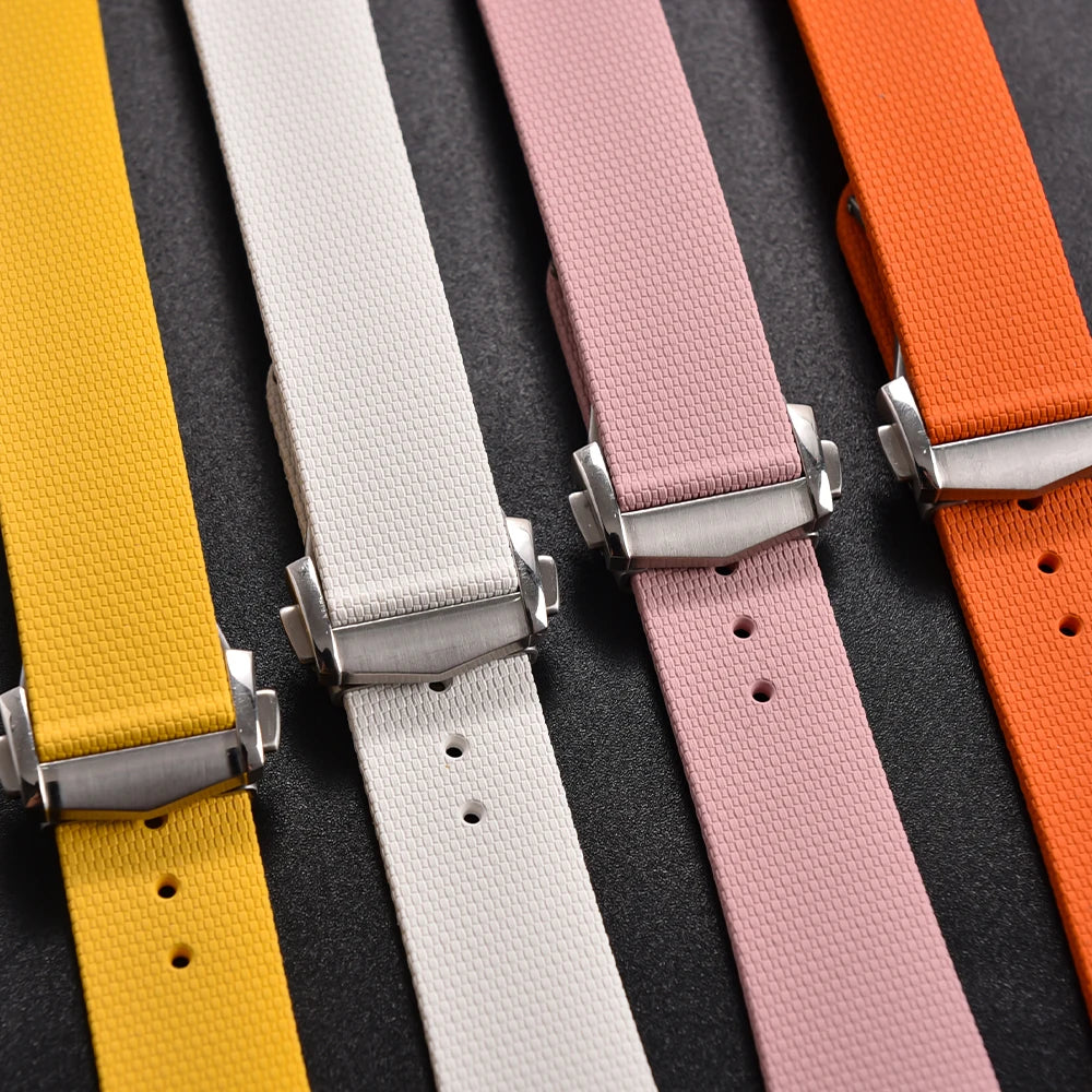 Set of colorful watch straps with metal buckles on a black background
