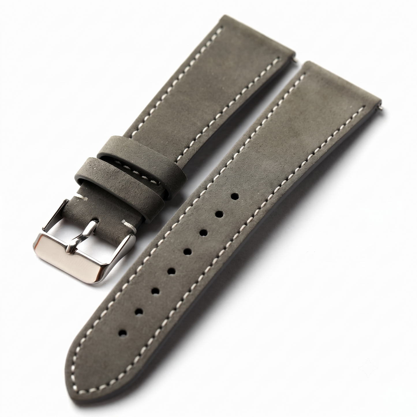 A gray suede watch strap with white contrast stitching and a silver-toned metal buckle, shown on a clean white background.