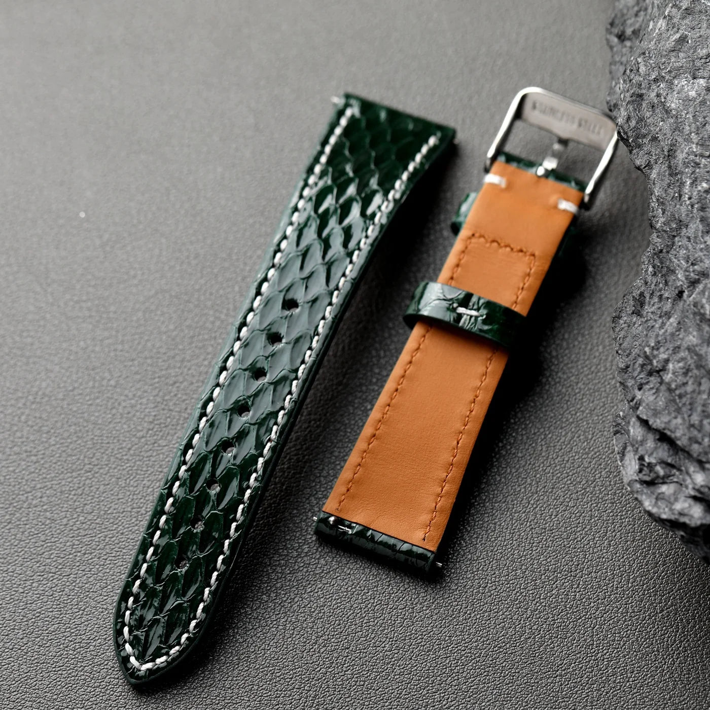 Python Snake Skin forest green python snake skin watch straps with silver buckle on table